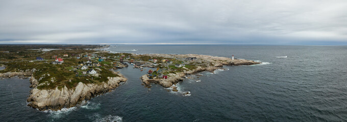 Aerial panoramic view of a small town near a rocky coast on the Atlantic Ocean. Taken in Peggy...