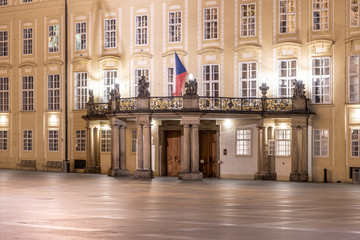 Entrance door with balcony to the Archives of Prague Castle on Third Courtyard by night, Prague, Czech Republic.
