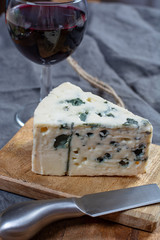 Roquefort soft French cheese made from sheep milk on  south of France, one of the world's best known blue cheeses with blue mold