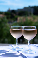 Rose wine of Provence, France, served cold on outdoor terrace in two wine glasses