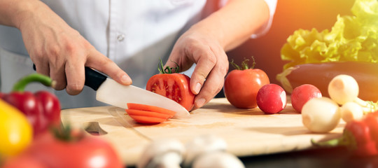Chef prepares fresh vegetables. Healthy nutrition