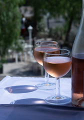 Rose wine of Provence, France, served cold on outdoor terrace in two wine glasses