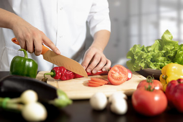 Chef prepares fresh vegetables. Healthy nutrition