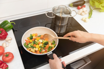 Fresh vegetables fried in a pan. Healthy nutrition concept