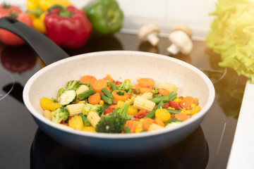 Fresh vegetables fried in a pan. Healthy nutrition concept