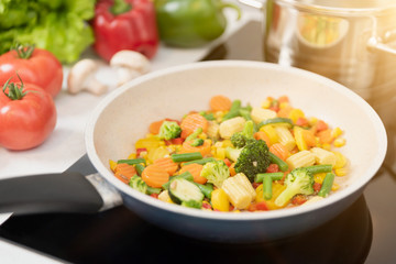 Fresh vegetables fried in a pan. Healthy nutrition concept
