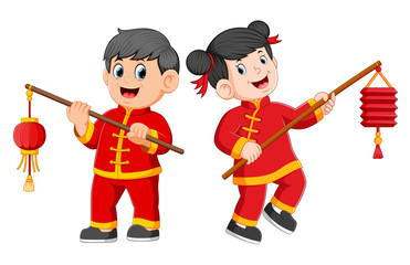 Obraz premium a happy children standing and holding a chinese paper lantern