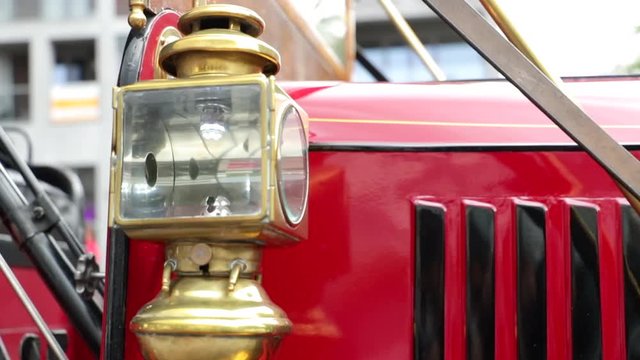 Close up shot of a brass horn and a vintage lantern on an oldtimer bus coach.