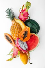 Gordijnen Flat lay tropical fruit layout made of dragon fruit, watermelon, papaya and pineapple on a white background, creative summer food concept © SEE D JAN