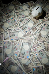 Piggy bank with Japanese yen banknote 