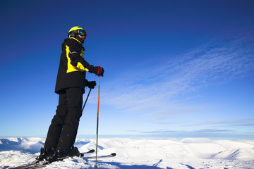 Skier on mountain peak