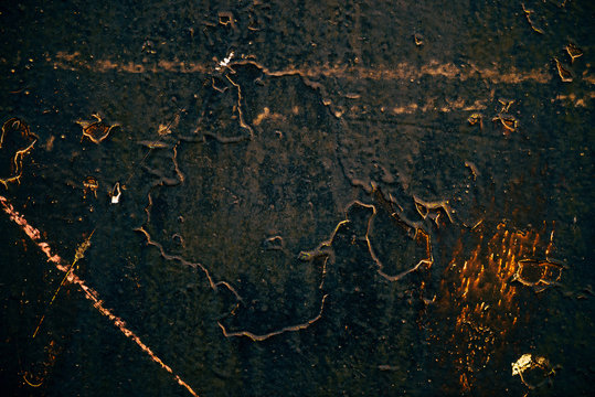 Black golden vintage art background. Texture of decorative Venetian stucco. Sample. Gold magic book cover. Spotted scratched wall close-up. Backdrop of painted plaster in macro. Artwork textured plate