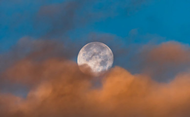 Full Moon with beautiful morning light and clouds.