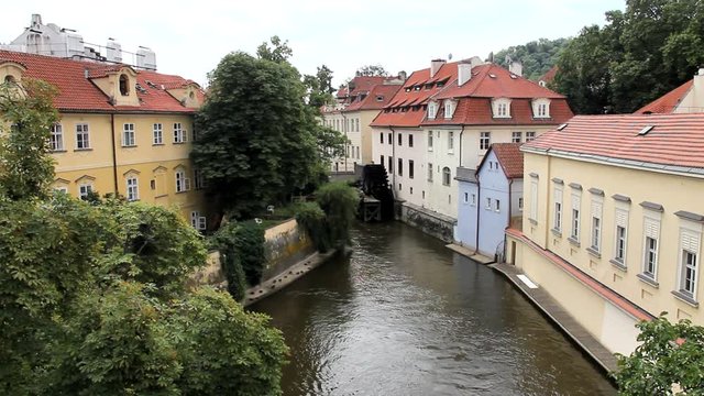 View of the island of Kampa and channel Certovka, also called stream of the devil, and of one of its famous windmills. Prague, Czech Republic