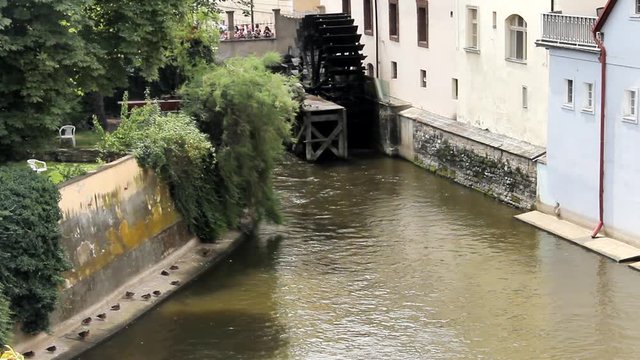 View of the island of Kampa and channel Certovka, also called stream of the devil, and of one of its famous windmills. Prague, Czech Republic