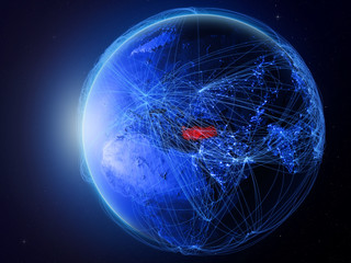 Turkey from space on planet Earth with blue digital network representing international communication, technology and travel.