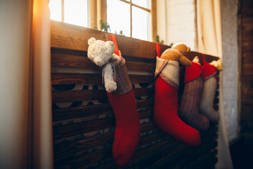 Christmas socks with toys on the window