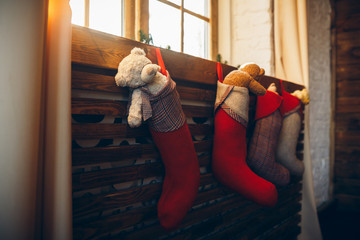 Christmas socks with toys on the window