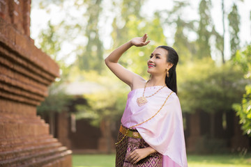 Beautiful Woman wearing typical Thai dress