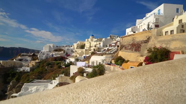 Picturesque cliffside town of Oia on the mediterranean island of  Santorini, Greece, slow motion