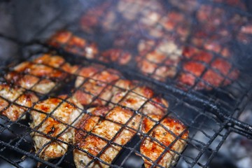  chicken grilled shashlik on the grill. Fried crust.