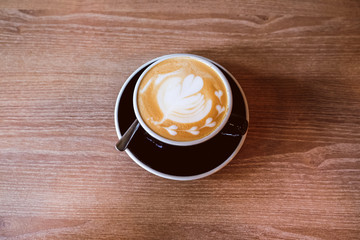 Hot Latte Coffee on wooden floor