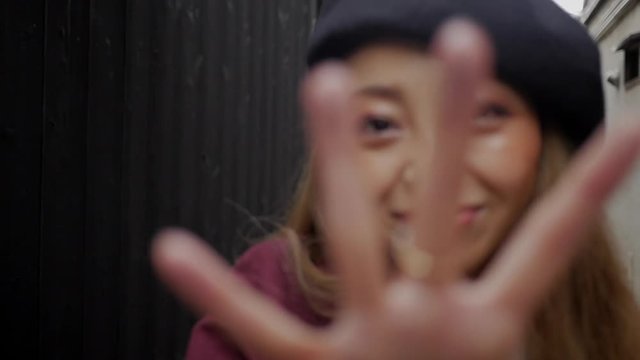 Cute Japanese model reaches out and blocks camera with her hand,Slow motion HD
