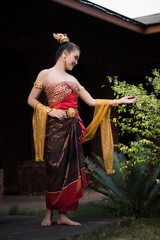 Obraz na płótnie Canvas Beautiful Woman wearing typical Thai dress