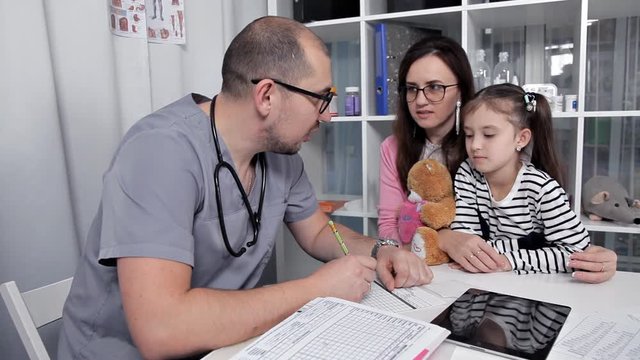 After examining the child, the doctor prescribes medications and necessary tests