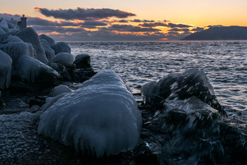 The icy stones on the shore of Lake Baikal