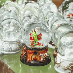 Glass Christmas toys, souvenirs - snowballs on the counter of the Christmas market
