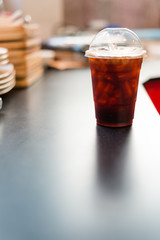 ice black coffee and splash bokeh lighting in christmas holidays