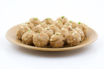 Indian Traditional Sweet Food Urad Dal Laddu Also Know as Laddoo, Ladoo, Laddo are Ball-Shaped Sweets Made of Butter, Dry Fruits, Fenugreek and other Spices. Urad Dal laddu Sweet Mostly Eat in Winter