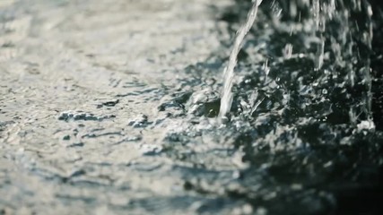 Black toned water not for drink close up slow motion