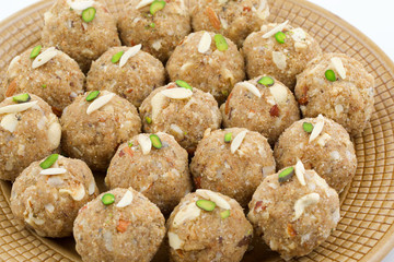 Indian Traditional Sweet Food Urad Dal Laddu Also Know as Laddoo, Ladoo, Laddo are Ball-Shaped Sweets Made of Butter, Dry Fruits, Fenugreek and other Spices. Urad Dal laddu Sweet Mostly Eat in Winter