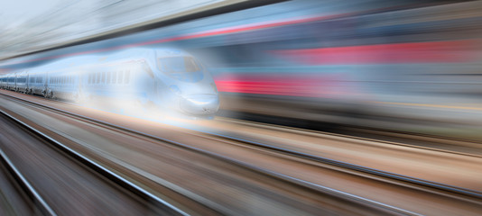 Fototapeta na wymiar High speed train in motion on the railway station