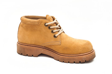 Yellow boot on a tractor sole. White isolated background