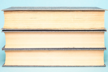 Books on a cold blue background. Close
