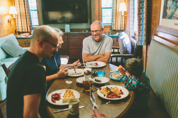 A family eating breakfast together.