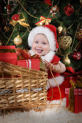 Little funny girl in Santa costume