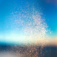 Blue abstract Christmas background with Glitter vintage lights and Golden sparkles