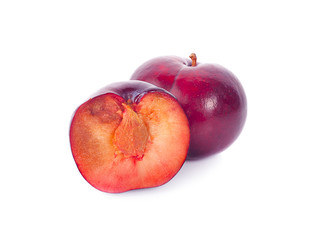 whole and half with slice of red cherry plums isolated on white background