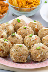Indian Traditional Sweet Food Urad Dal Laddu Also Know as Laddoo, Ladoo, Laddo are Ball-Shaped Sweets Made of Butter, Dry Fruits, Fenugreek and other Spices. Urad Dal laddu Sweet Mostly Eat in Winter