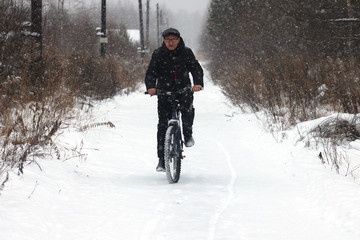 Extreme travel by bicycle in the winter forest.