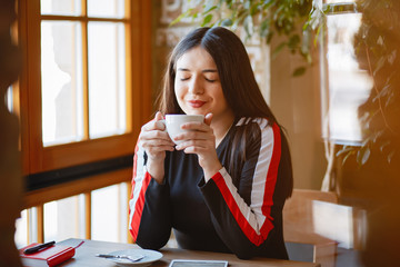 Fototapeta premium Businesswoman in a cafe