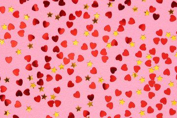 Pink background with red confetti hearts for Valentine Day	