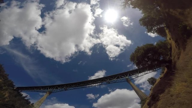 upward view of blue sky and bridge