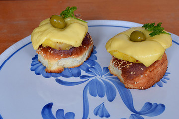Hawaiian toast on a platter and pineapple.