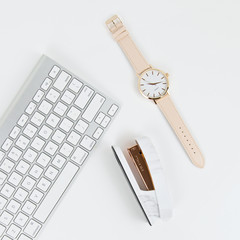 white keyboard with wristwatch