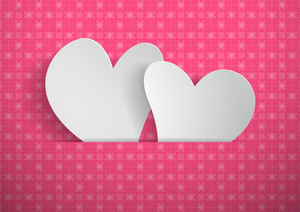 Hearts cut from paper with pink pattern background